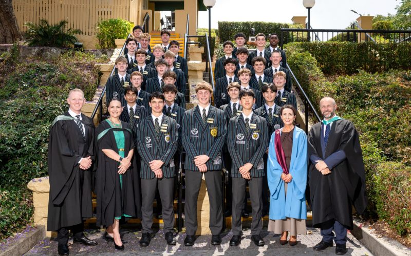2026 Prefects and Senior Staff Members standing on entry steps after being inducted.